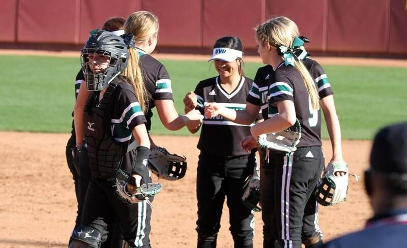 Part of the UVU softball team huddles up at Arizona State's Farrington Stadium last weekend at the Kajikawa Classic in Tempe.