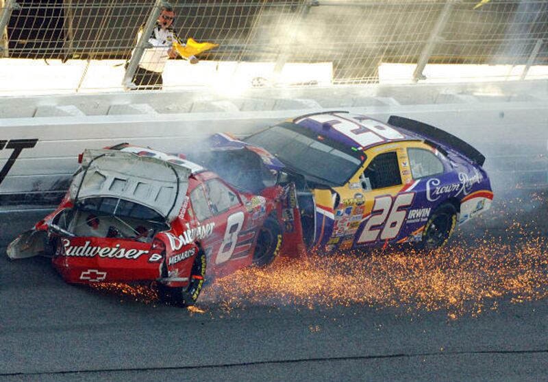 NASCAR drivers Dale Earnhardt Jr. (8) and Jamie McMurray (26) crash in the final laps of the Pep Boys Auto 500 on Sunday.