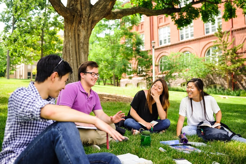 Members of InterVarsity Graduate Christian Fellowship at the University of Iowa hang out on campus. The group has filed a lawsuit against the school defending the rights of religious campus organizations.