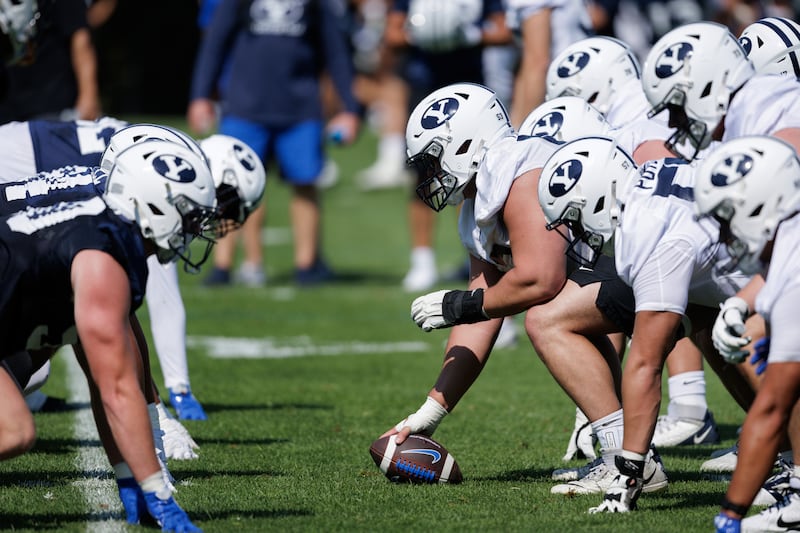 BYU players wait for the snap during opening day of fall camp Wednesday, Aug. 5, 2026, in Provo.