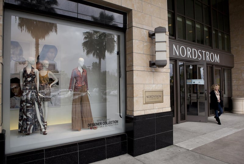 In this Feb. 15, 2012 file photo, a shopper leaves a Nordstrom department store in the Woodland Hills section of Los Angeles. Nordstrom Inc. was co-founded in 1901 by John W. Nordstrom. His family has run the department store operator for four generations