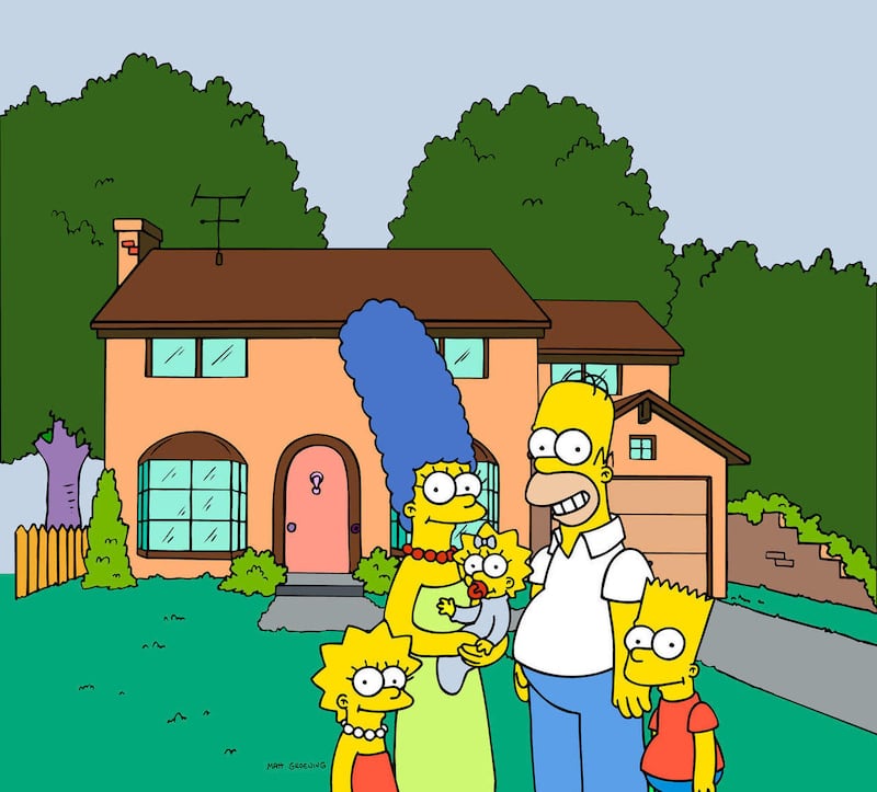 FILE - This undated frame from the Fox series “The Simpsons,” shows the popular cartoon family posing in front of their home, from left, Lisa , Marge , Maggie, Homer and Bart Simpson. Television networks are masters of self-promotion, so it’s no surprise