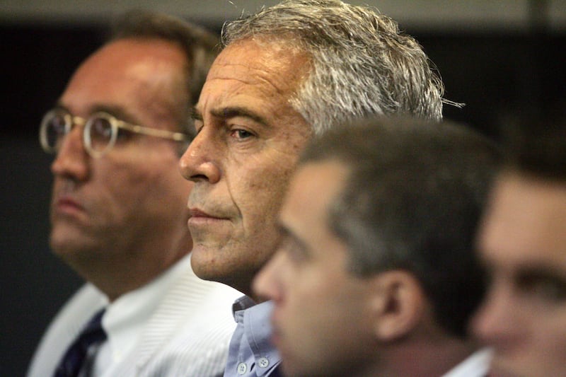 FILE - In this July 30, 2008, file photo, Jeffrey Epstein, center, appears in court in West Palm Beach, Fla. Federal prosecutors, preparing for a bail fight Monday, July 15, 2019, say evidence against Epstein is growing “stronger by the day” after several