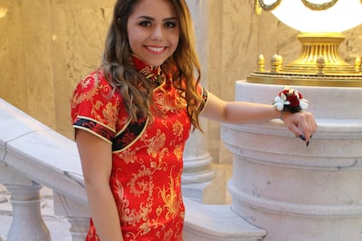 Keziah Daum poses for a prom photo at the state Capitol in Salt Lake City on April 21, 2018. The Utah student wore a Chinese dress called a cheongsam to prom, though she is not Chinese.