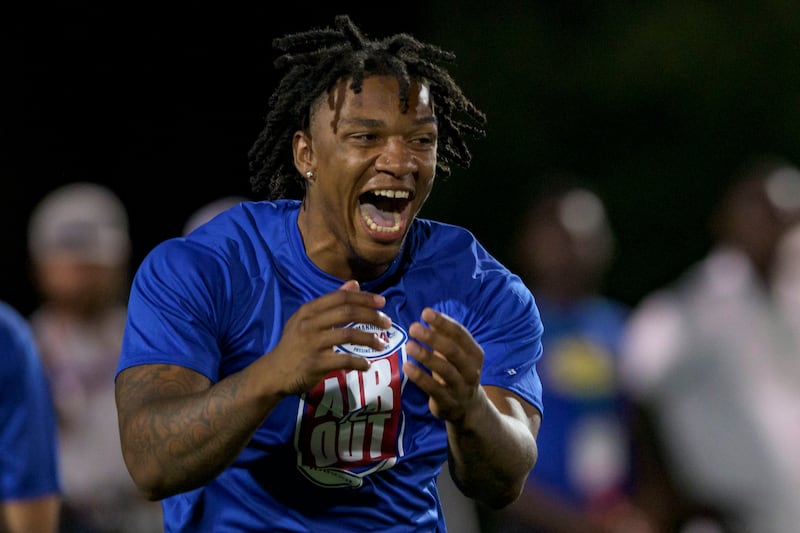Florida quarterback Anthony Richardson celebrates after making deep throw during the Manning Passing Academy.