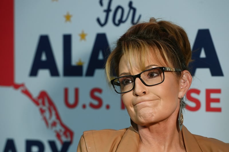 U.S. House candidate Sarah Palin speaks to the media at her campaign headquarters.