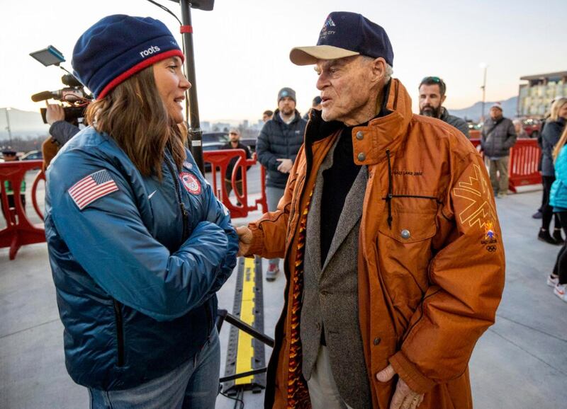 Salt Lake City Mayor Erin Mendenhall and Spence Eccles talk as they join hundreds gathered at Rice-Eccles Stadium at the University of Utah on Tuesday, Feb. 8, 2022, to watch the Olympic Cauldron be lit, marking the 20-year anniversary of the Salt Lake 2002 Olympics opening ceremony.