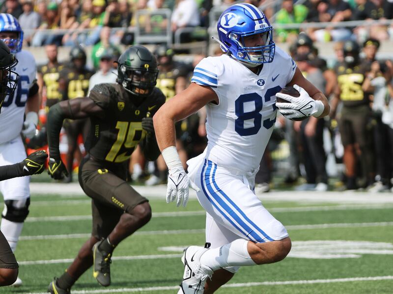 BYU tight end Isaac Rex runs for a touchdown at Autzen Stadium in Eugene on Saturday, Sept. 17, 2022.