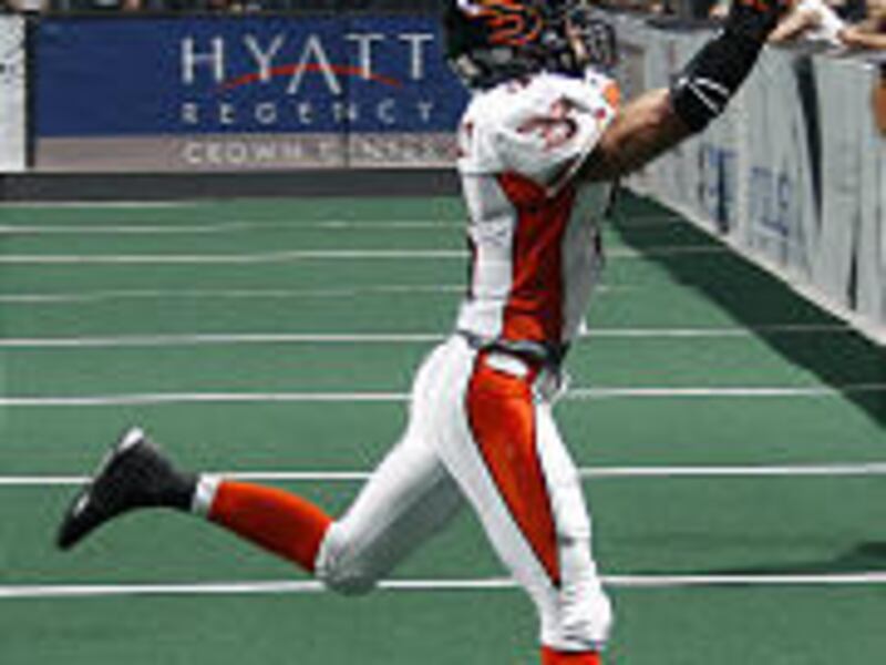 Blaze receiver Siaha Burley \— who caught touchdown passes of 30 and 8 yards \— attempts to pull in a pass from QB Joe Germaine.