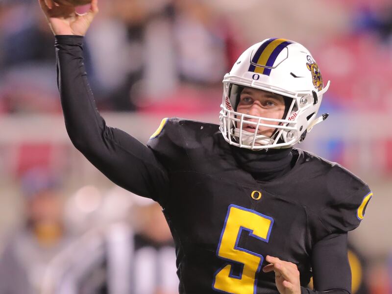 Orem's quarterback Cooper Legas passes the ball to an open Puka Nacua for a touchdown as Orem and Pine View play in 4A semifinal football action at Rice-Eccles Stadium at the University of Utah in Salt Lake City on Friday, Nov. 9, 2018. Orem won 62-20.