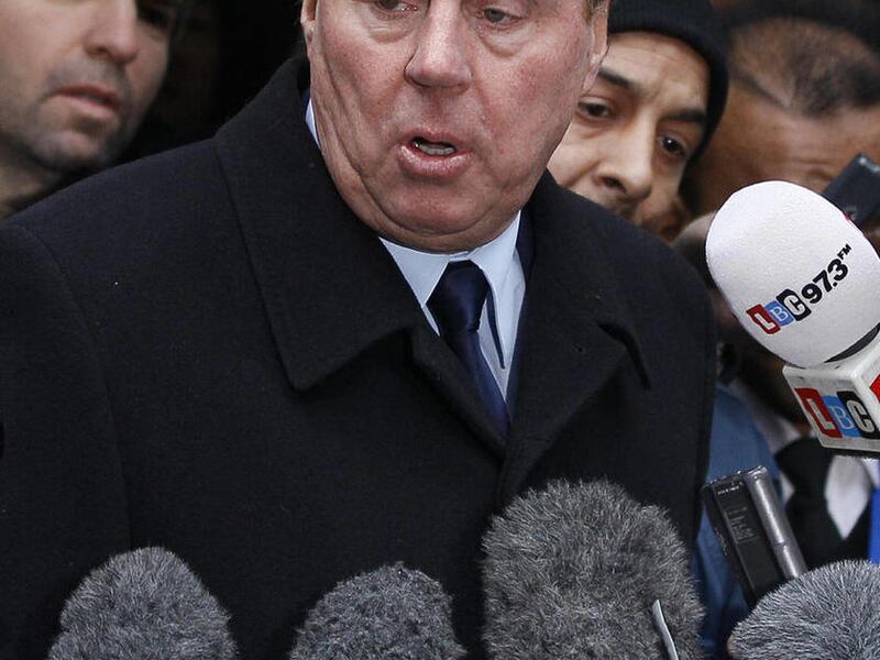 FILE - In this Feb. 8, 2012 file photo, Tottenham Hotspur football club manager Harry Redknapp delivers a statement outside Southwark Crown Court in London. Redknapp has been fired by Tottenham after almost four years as manager, paying the price for a co
