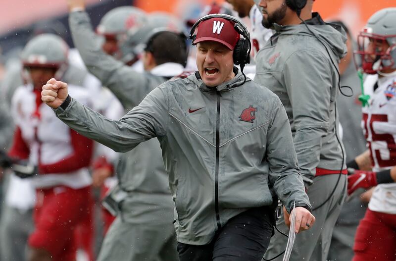 Washington State removed the interim tag from coach Jake Dickert’s title as he prepares for his first full year at the helm.