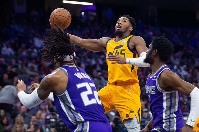 Utah Jazz guard Donovan Mitchell drives to the basket against the Sacramento Kings in Sacramento, Calif., Nov. 20, 2021.