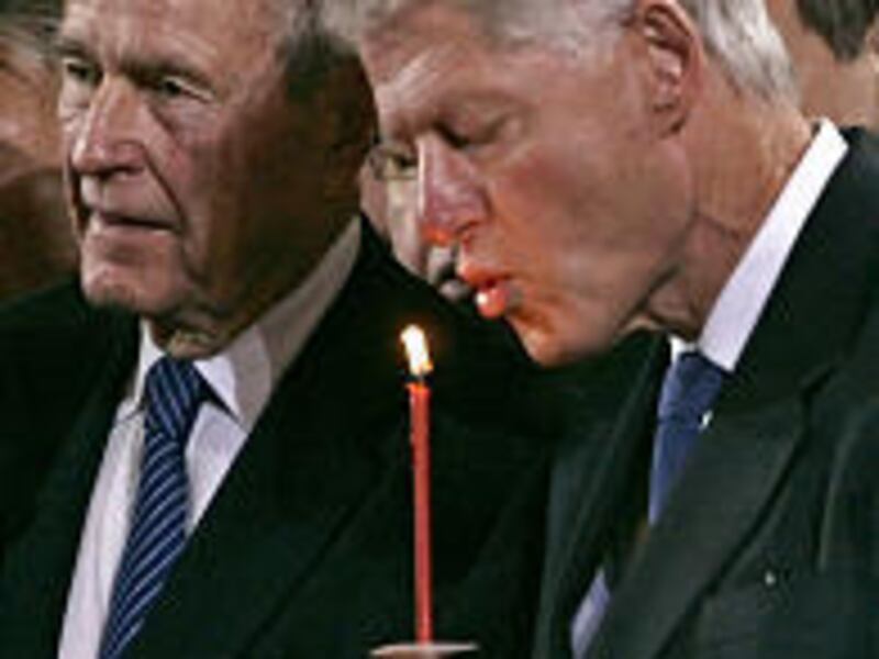 Former U.S. Presidents George H.W. Bush and Bill Clinton attend farewell ceremony to Boris Yeltsin inside the Cathedral of Christ the Savior in Moscow on Wednesday.
