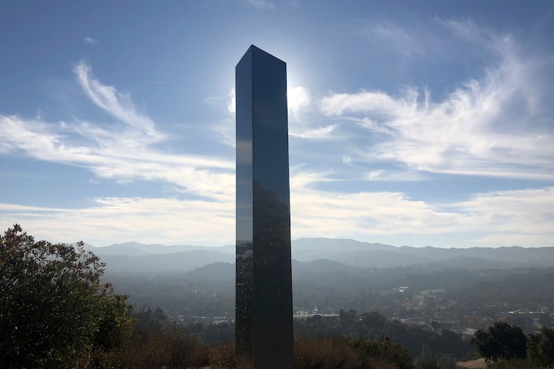 A monolith stands on a Stadium Park hillside in Atascadero, Calif., Tuesday, Dec. 2, 2020. A new group show in New York shows off even more monoliths.