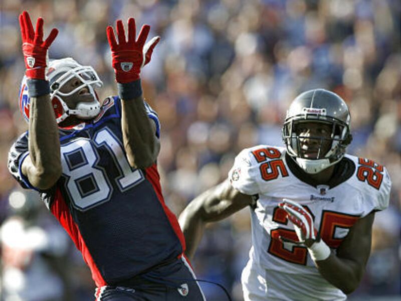 Buffalo Bills wide receiver Terrell Owens (81) drops a pass as Tampa Bay Buccaneers cornerback Aqib Talib (25) defends.