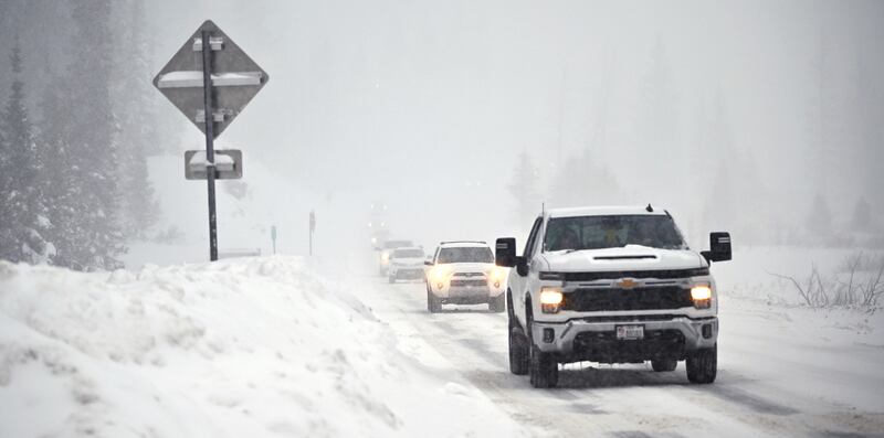 Traffic moves up and down Big Cottonwood Canyon in the snow on Jan. 14, 2024.