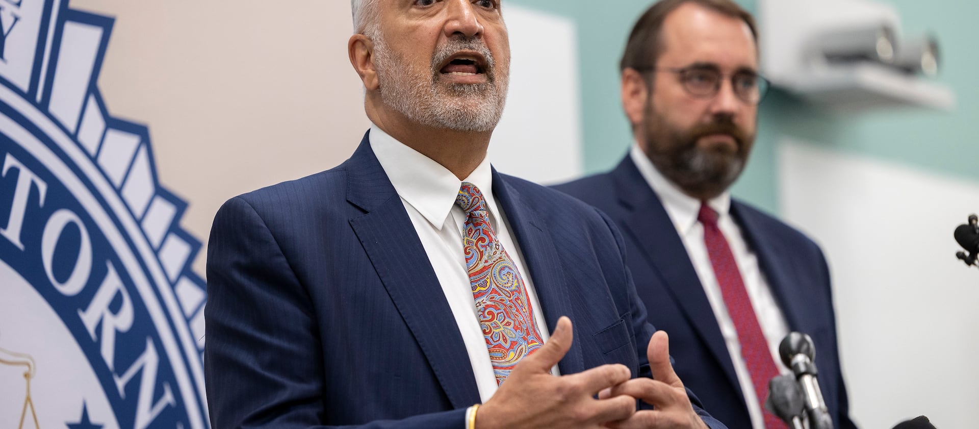 Salt Lake County District Attorney Sim Gill, left, discusses the death penalty in Utah.