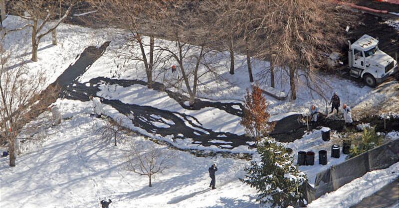 Workers from Salt Lake City Fire Department and Chevron work to clean up an oil spill at the Red Butte Gardens next to the University of Utah Dec. 2, 2010