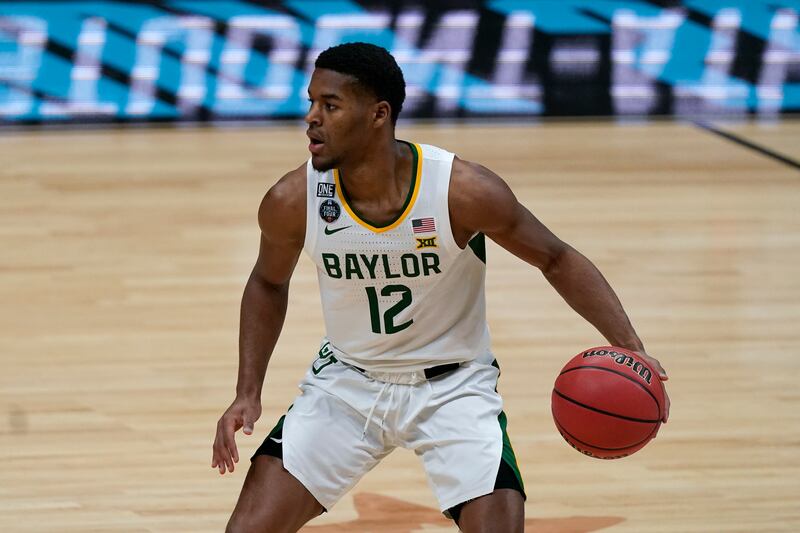 Baylor guard Jared Butler drives up court during a men’s Final Four NCAA college basketball tournament semifinal game