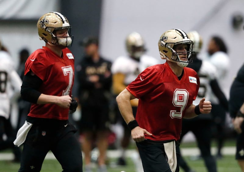New Orleans Saints quarterbacks Drew Brees (9) and Taysom Hill (7) warm up during practice at their NFL football training facility in Metairie, La., Thursday, Jan. 17, 2019. The Saints will host the Los Angeles Rams for the NFC Championship on Sunday, Jan