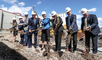 Pamela Atkinson, a Utah-based humanitarian and advocate for people experiencing homelessness, center, is joined by Gov. Gary Herbert, left, and Salt Lake City Mayor Jackie Biskupski, right, and other dignitaries during a groundbreaking ceremony for Pamela