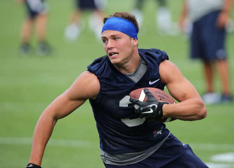 Wide receiver Colby Pearson runs after a catch as BYU opens their first day of football camp Aug. 8, 2015, in Provo.