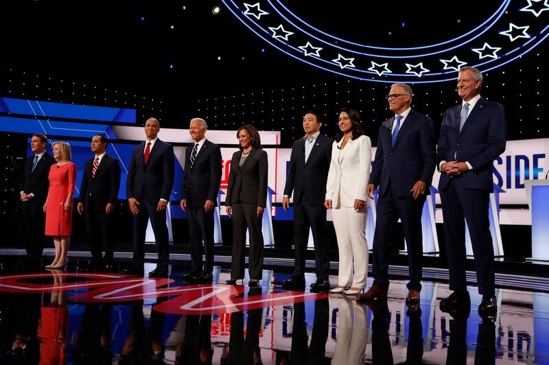 From left, Sen. Michael Bennet, D-Colo., Sen. Kirsten Gillibrand, D-N.Y., former Housing and Urban Development Secretary Julian Castro, Sen. Cory Booker, D-N.J., former Vice President Joe Biden, Sen. Kamala Harris, D-Calif., Andrew Yang, Rep. Tulsi Gabbar