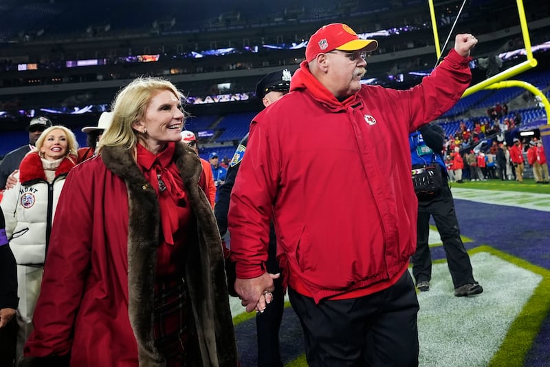Kansas City Chiefs head coach Andy Reid walks off the field with his wife Tammy Reid after the AFC Championship NFL game.