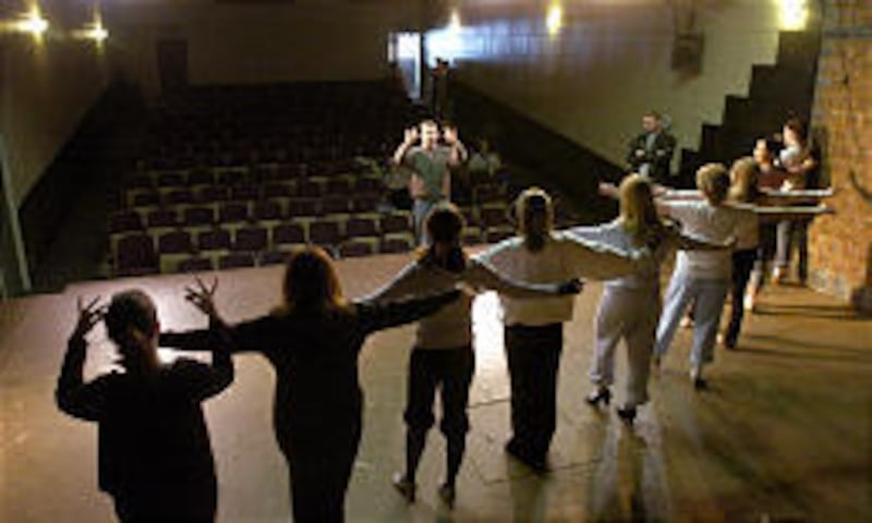 Artistic director Kevin McClellan, center, works with the cast of "Copacabana" at the Draper Historic Theatre. The production runs Feb. 26 through March 27.