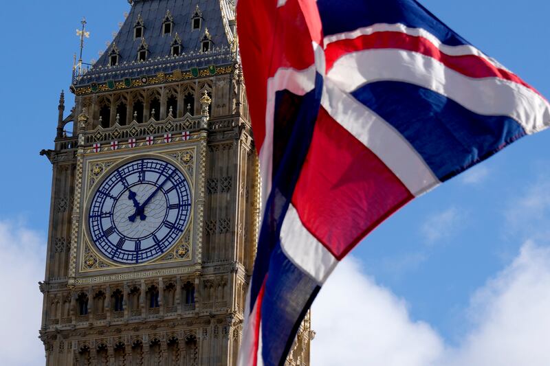 The Union flag flaps in the wind outside the Houses of Parliament in London, Monday, Oct. 24, 2022.