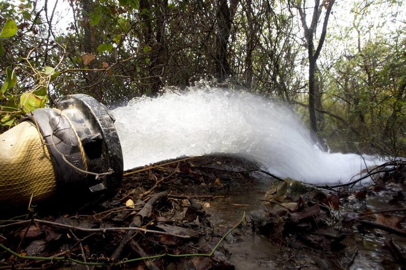 In this Nov. 16, 2011, photo, water pumped from a quarry flows from Jack Creek into the Navasota River at the Confederate Reunion Grounds State Historic Site in Groesbeck, Texas. The City of Groesbeck is on the verge of running out of water since there is