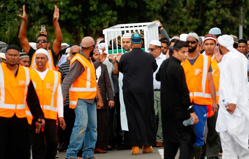 Mourners carry the body of Imam Hafiz Musa Patel, a victim of the Friday March 15 mosque shootings in Christchurch at the Puhinui Memorial Gardens in Auckland, New Zealand, Thursday, March 21, 2019.