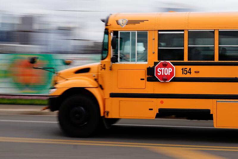 A school bus is driven in Philadelphia, Wednesday, Oct. 27, 2021.