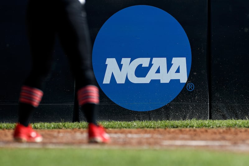 In this April 19, 2019, file photo, an athlete stands near a NCAA logo during a softball game in Beaumont, Texas