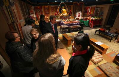 Tenzin Phunrab, president of the Utah Tibetan Association, right, talks with Melissa Lichtenstein in the prayer room as the Interfaith Bus Tour visits the Tibetan Community Center in Salt Lake City on Tuesday, Feb. 19, 2019. As part of Interfaith Month, p