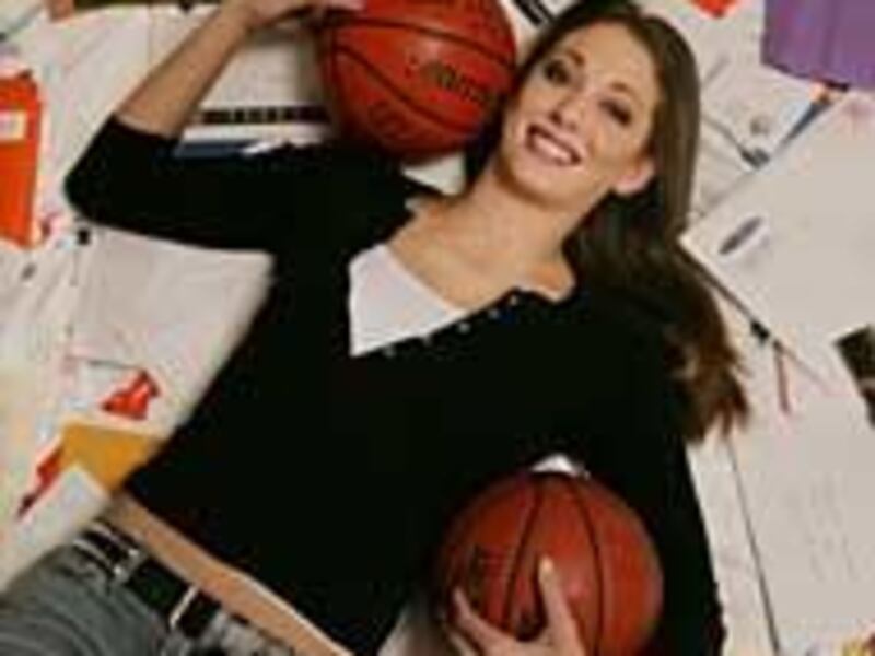 Mountain View basketball player Michelle Harrison poses with some of her 900 college recruitment letters.