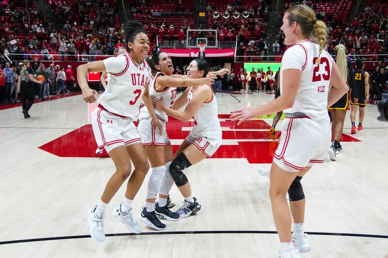 Utah women’s basketball players, from left, Lani White, Ines Vieira, Issy Palmer and Maty Wilke celebrate after the No. 20 Utes beat No. 6 USC at the Huntsman Center in Salt Lake City on Friday, Jan. 19, 2024.