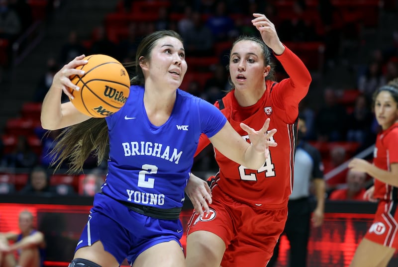 BYU’s Shaylee Gonzales drives against Utah’s Kennady McQueen at the Huntsman Center in Salt Lake City on Dec. 4, 2021.