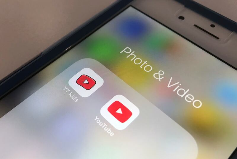 The YouTube app and YouTube Kids app are displayed on an iPhone in New York.