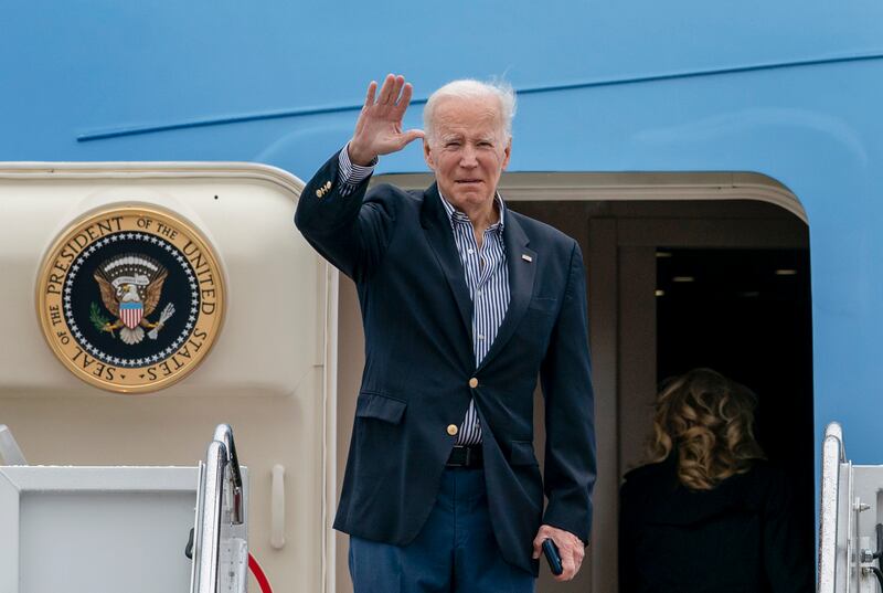 President Joe Biden waves before boarding Air Force One at Andrews Air Force Base, Md.