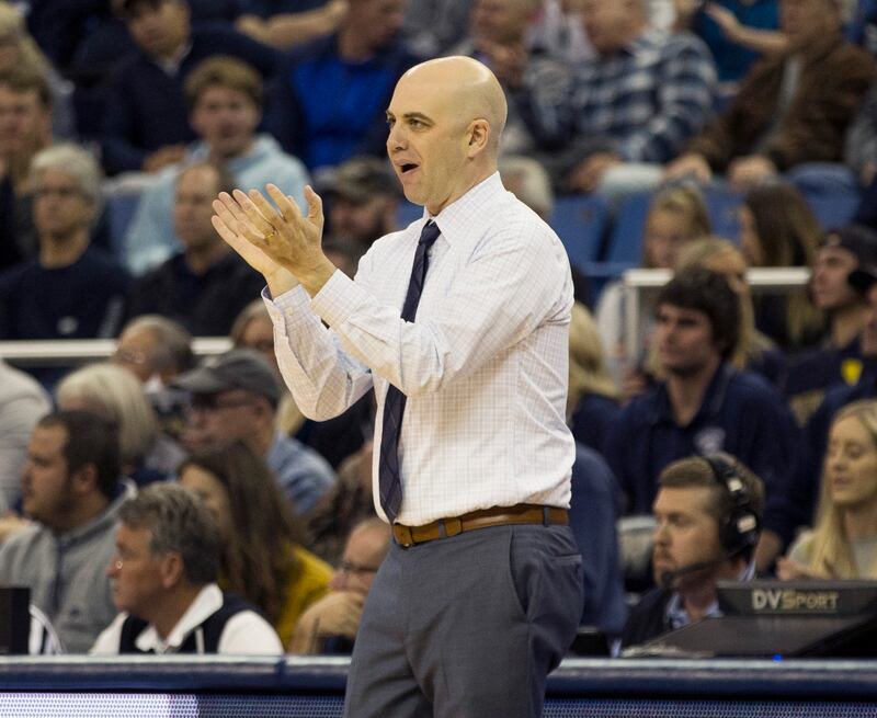 Utah State head coach Craig Smith works the sidelines against Nevada in the first half of an NCAA college basketball game in Reno, Nev., Wednesday, Jan. 2, 2019. (AP Photo/Tom R. Smedes)