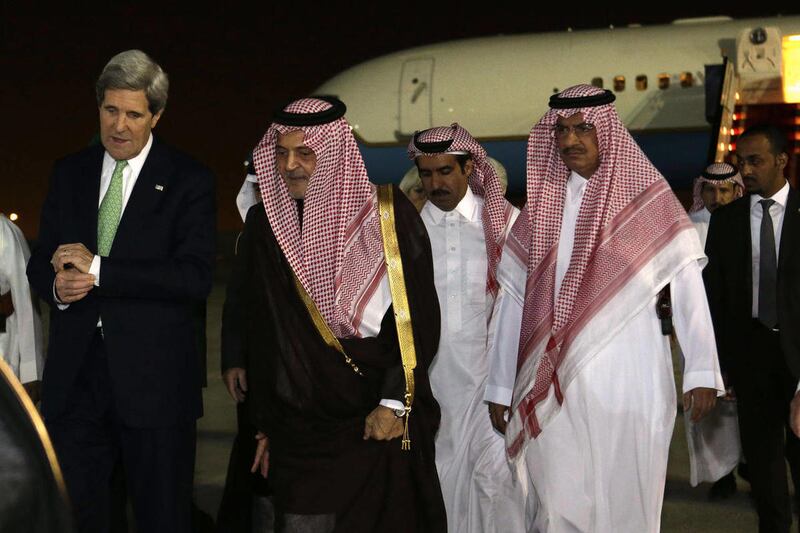 U.S. Secretary of State John Kerry, left, walks with Saudi Foreign Minister Prince Saud al-Faisal, on arrival in Riyadh, Saudi Arabia on Sunday, March 3, 2013.