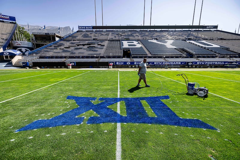 LaVell Edwards Stadium field crew member checks out his handiwork Thursday, Aug. 31 in Provo.