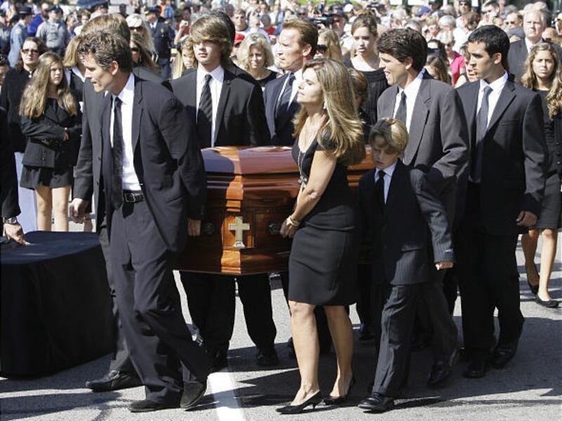 Members of the Shriver family, including Anthony Shriver, left, his sister Maria, front center, her husband, Gov. Arnold Schwarzenegger, rear center, and Tim Shriver, right, carry the casket of Eunice Kennedy Shriver on Friday.