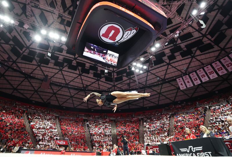 Utah Red Rocks gymnast Makenna Smith jumps on floor.