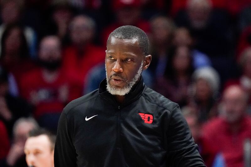 Dayton head coach Anthony Grant walks along the sideline during an NCAA college basketball game against Robert Morris in 2022.