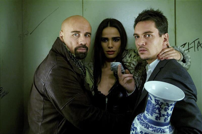 John Travolta, left, Melissa Mars and Jonathan Rhys Meyers in "From Paris."