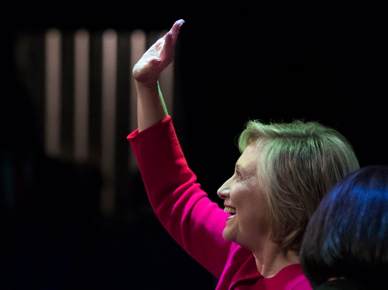 Hillary Clinton waves to the audience at the Warner Theatre in Washington, Monday, Sept. 18, 2017, for book tour event for her new book "What Happened" hosted by the Politics and Prose Bookstore.