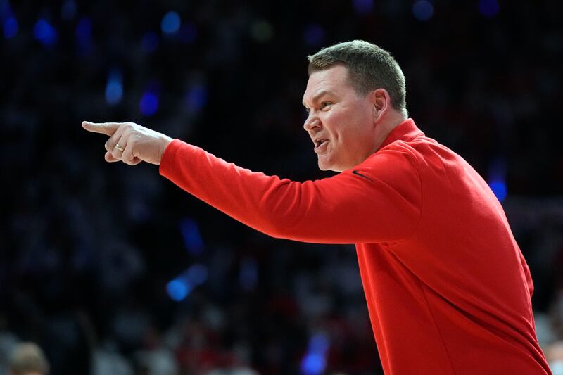 Arizona coach Tommy Lloyd points from the sideline during game against Oregon, Saturday, Feb. 19, 2022, in Tucson, Ariz.